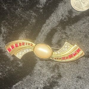 Elegant Gold and Red Brooch